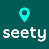 Op een donkergroene achtergrond staat in witte letters het woord 'seety'. Erboven staat een lichtgroen locatie-icoon